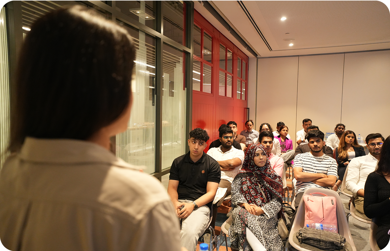 Diverse audience engaged in AI workshop discussion