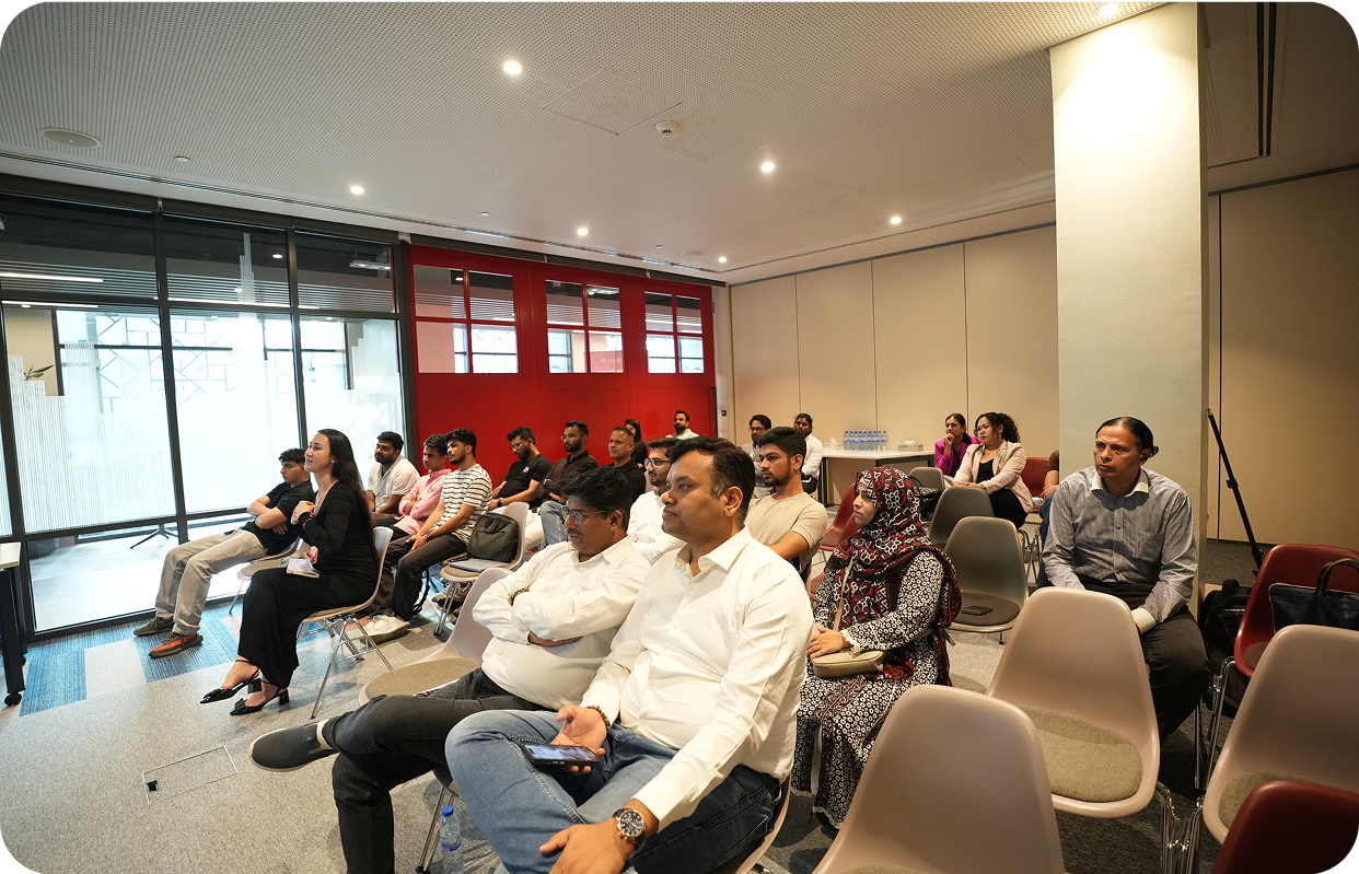 Diverse audience engaged in AI workshop discussion